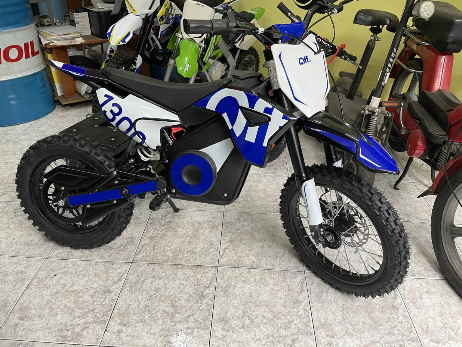 Pit bike elettrica OFFMX 1300W litio ruote 14″12″, foto 7