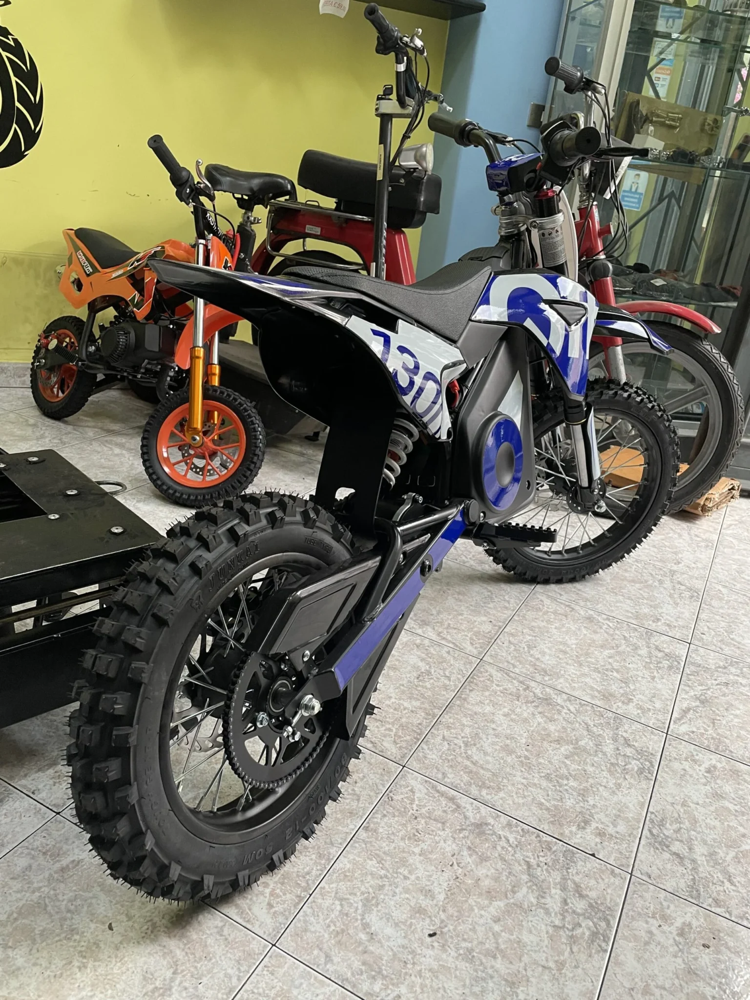 Pit bike elettrica OFFMX 1300W litio ruote 14″12″, foto 6
